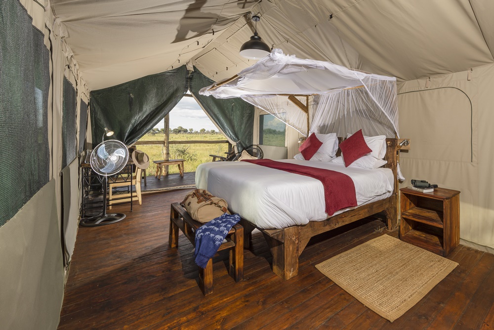 A spacious tent at Mogogelo camp with king bed