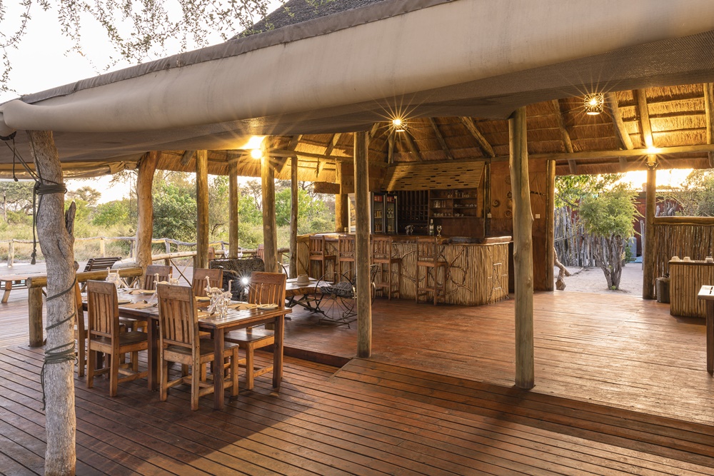 The dining area and bar welcome you at Mogogelo Camp